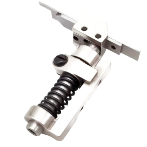 Close-up of the Yamato #3020002 guide collar, showing its metal construction and precise design for seamless fabric cutting in industrial sewing machines."*